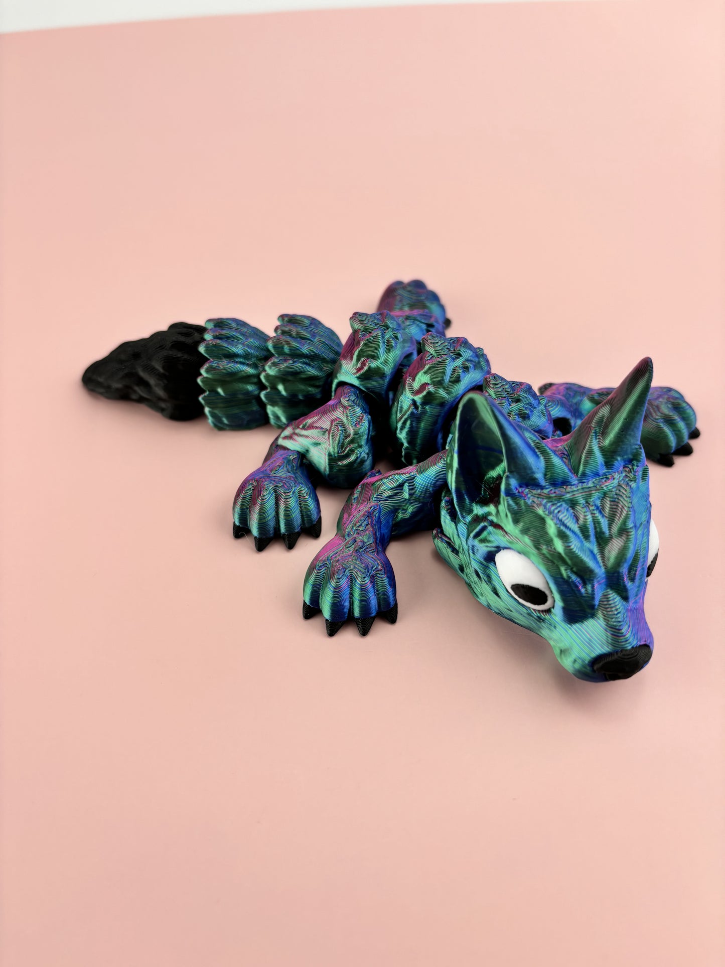 Tiny Wolf Pup 3D Printed in Vibrant Blues, Purples, and Greens.