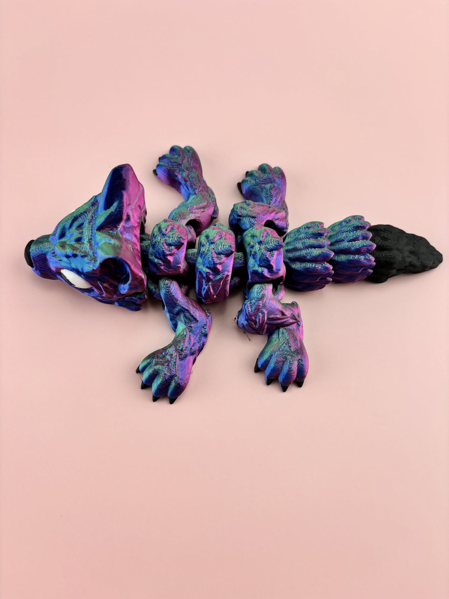 Tiny Wolf Pup 3D Printed in Vibrant Blues, Purples, and Greens.