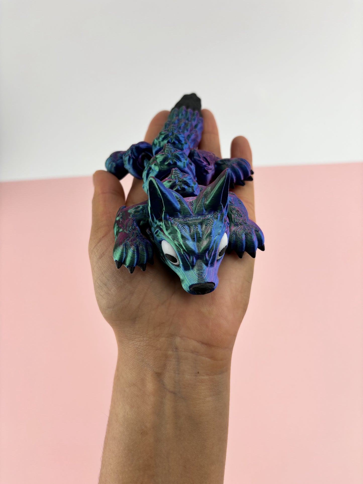 Tiny Wolf Pup 3D Printed in Vibrant Blues, Purples, and Greens.