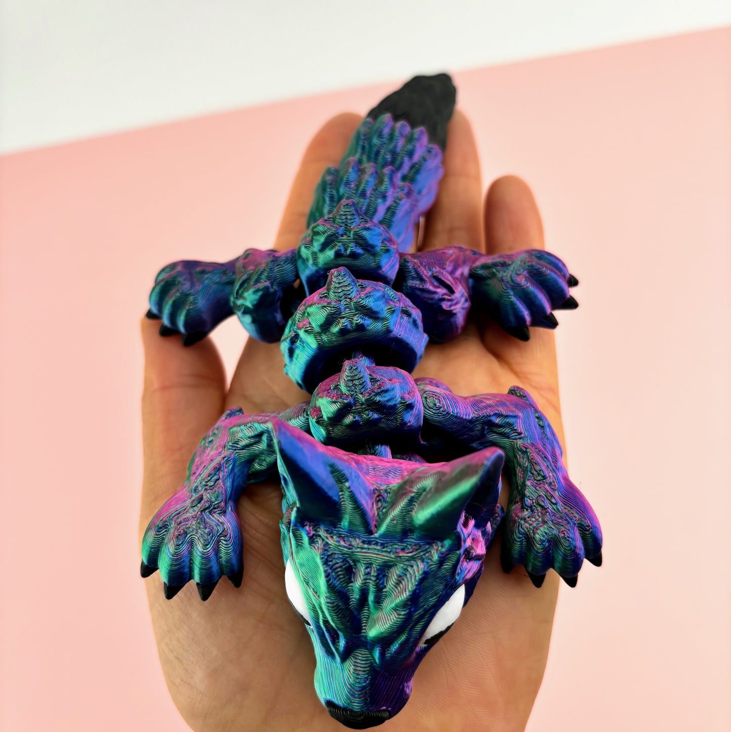 Tiny Wolf Pup 3D Printed in Vibrant Blues, Purples, and Greens.