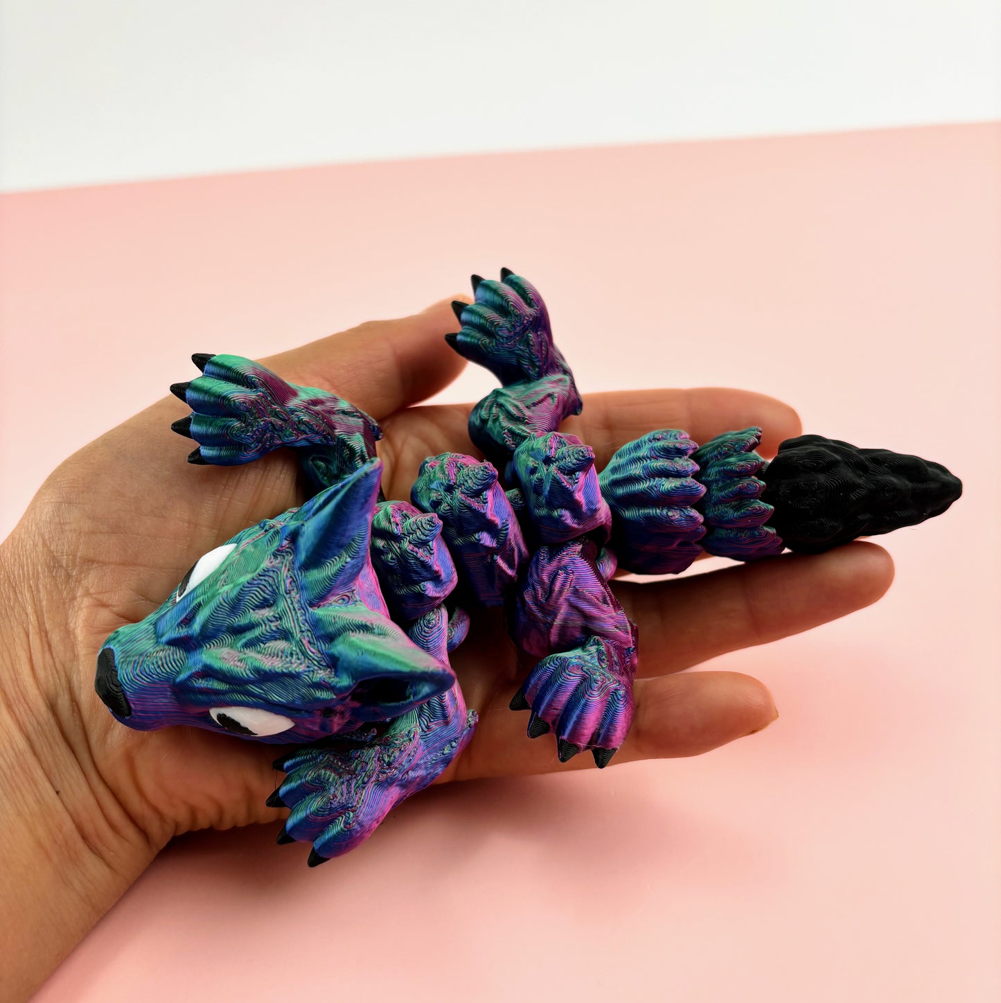 Tiny Wolf Pup 3D Printed in Vibrant Blues, Purples, and Greens.