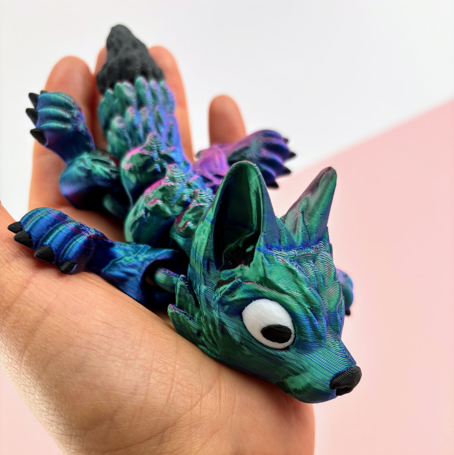 Tiny Wolf Pup 3D Printed in Vibrant Blues, Purples, and Greens.