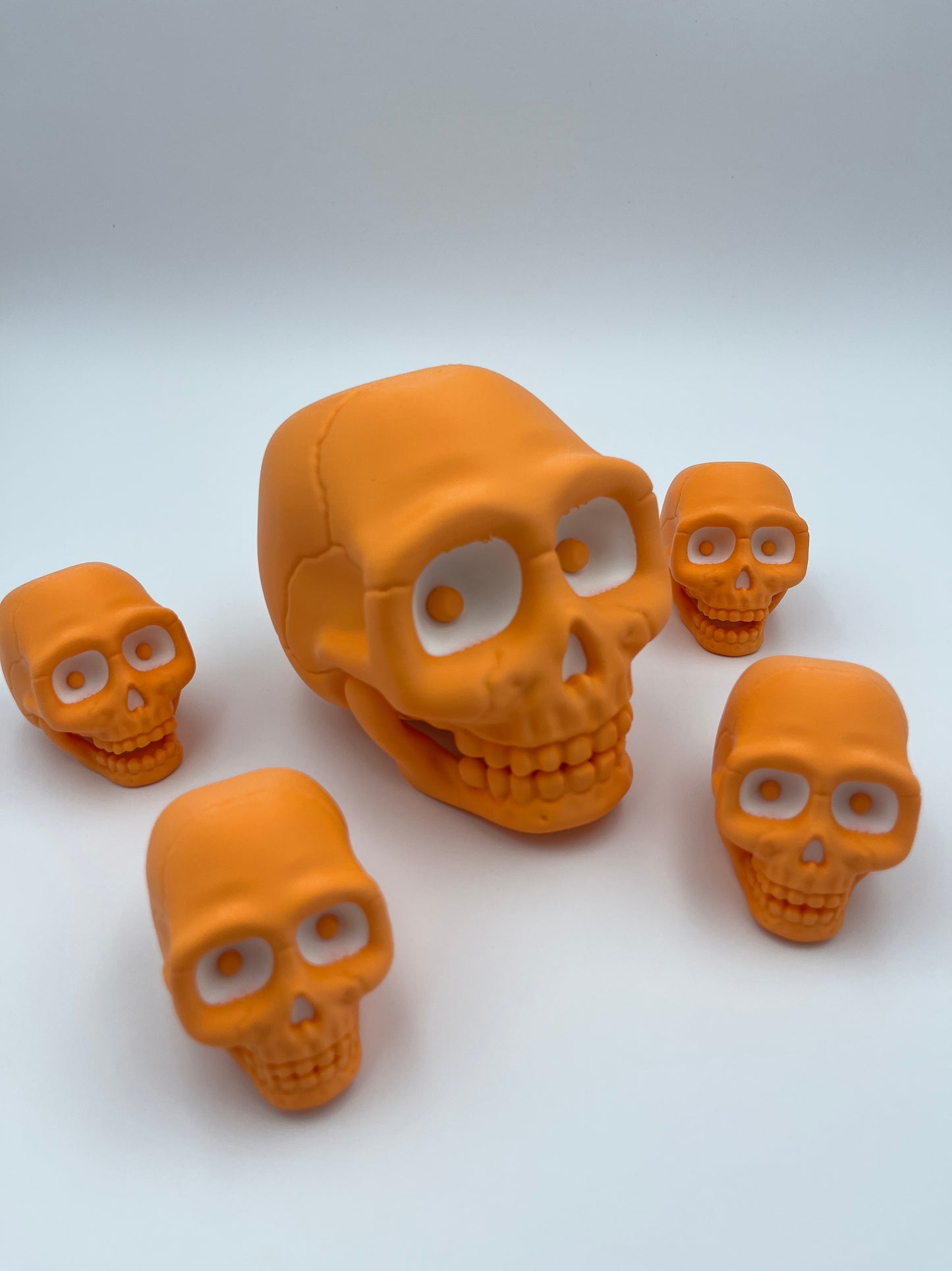 Orange Skull Figurine – Designer Credit: McGybeer (Small & Large)