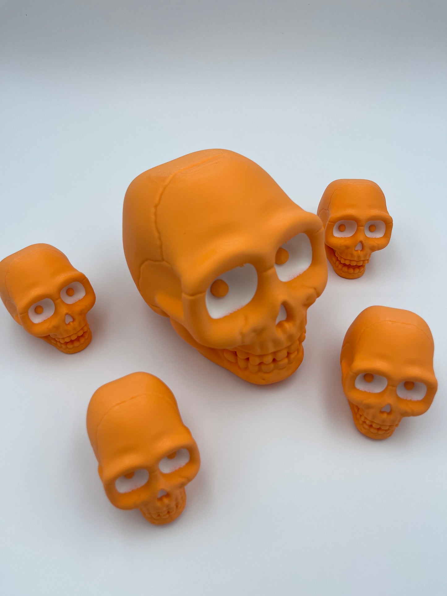 Orange Skull Figurine – Designer Credit: McGybeer (Small & Large)