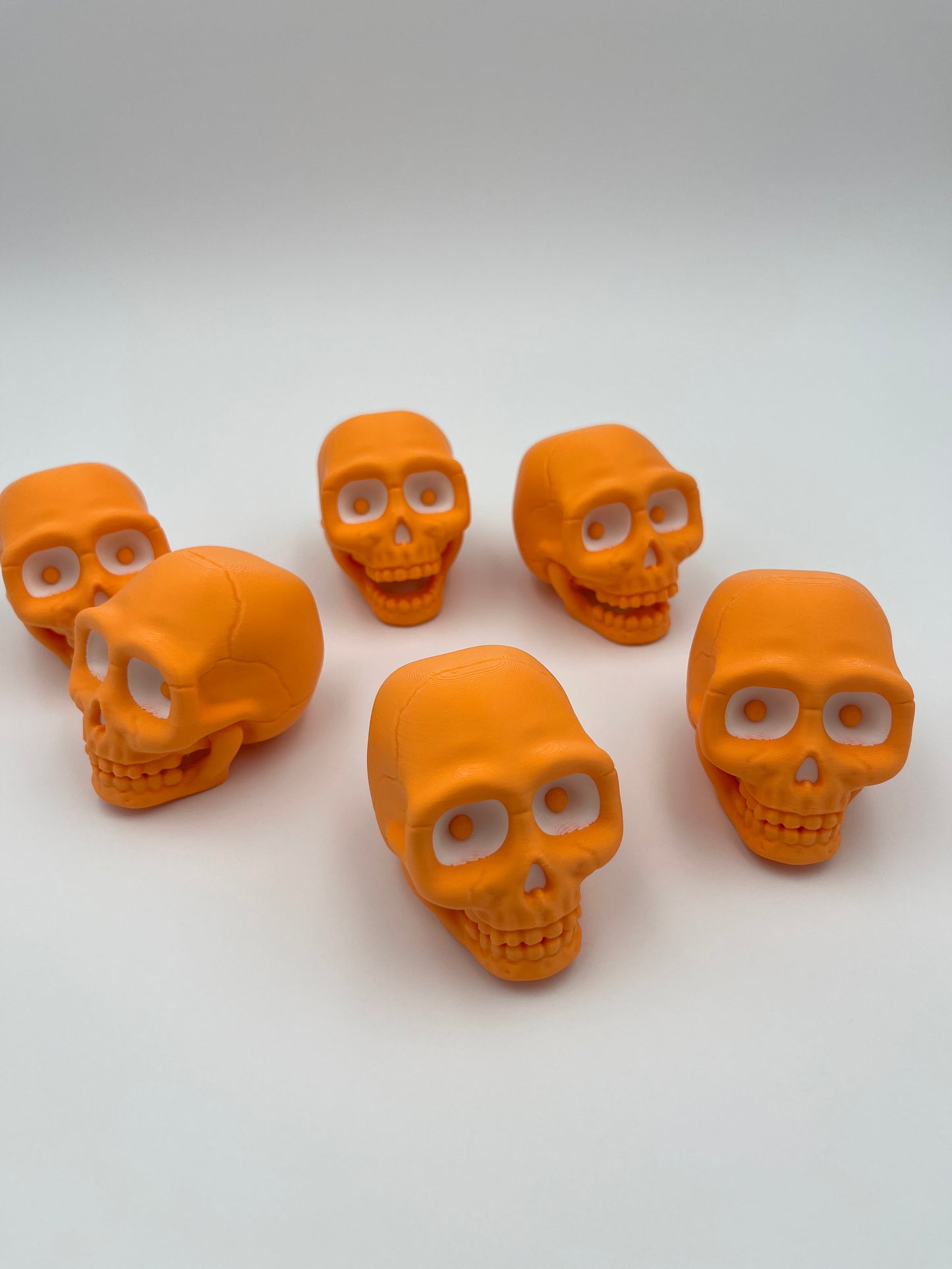 Orange Skull Figurine – Designer Credit: McGybeer (Small & Large)