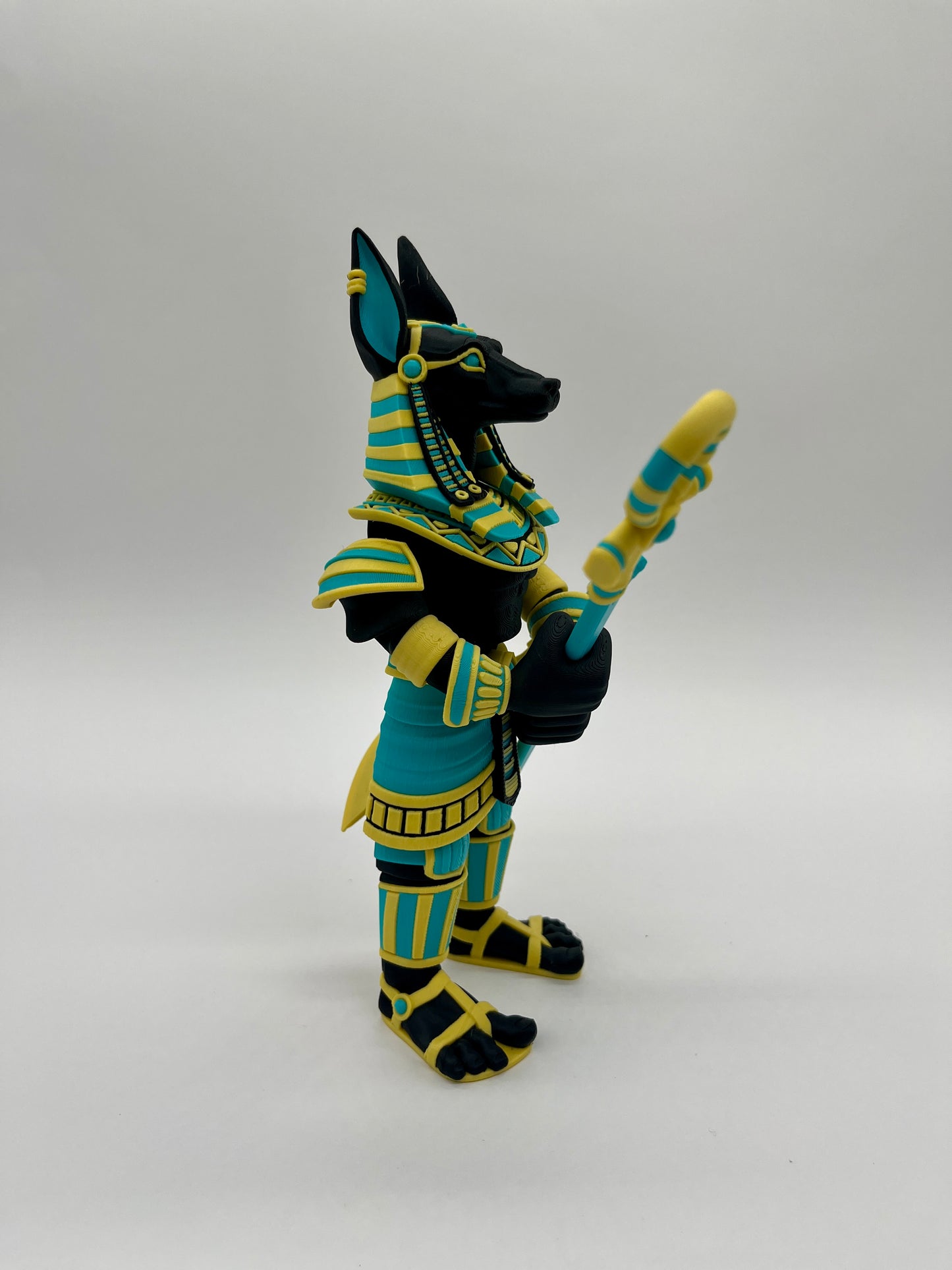 Anubis – Guardian Warrior Figurine (Black, Yellow & Teal)
