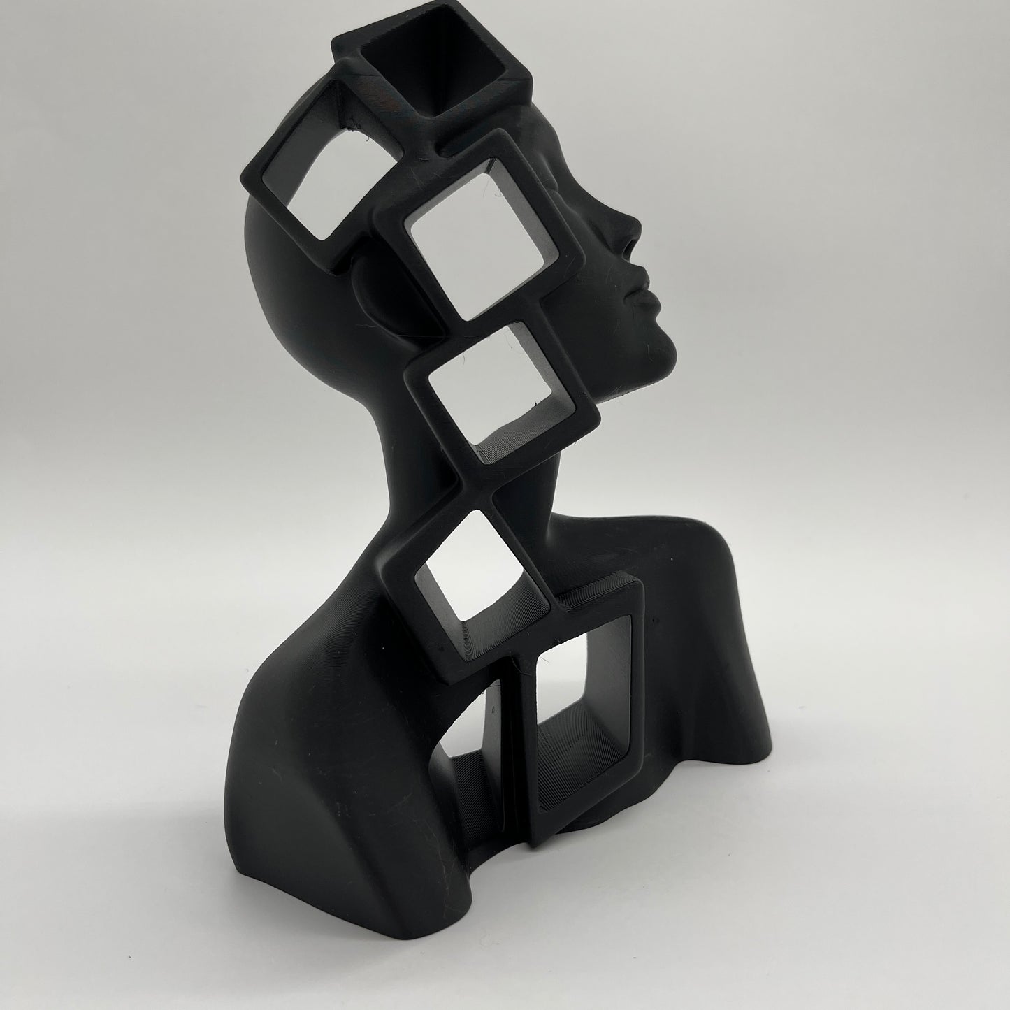 Cube-in-Girl Statue — Matte Charcoal Black