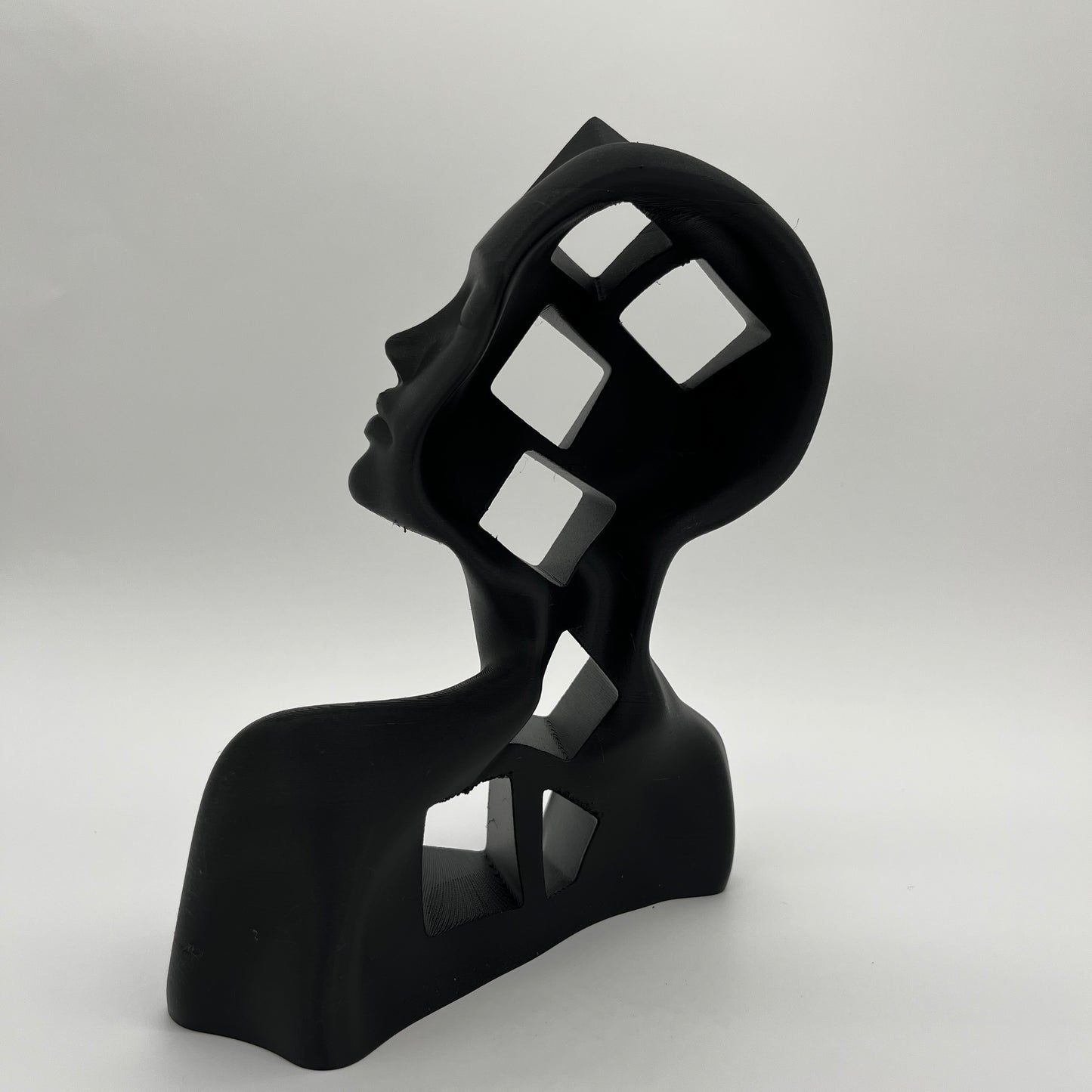 Cube-in-Girl Statue — Matte Charcoal Black