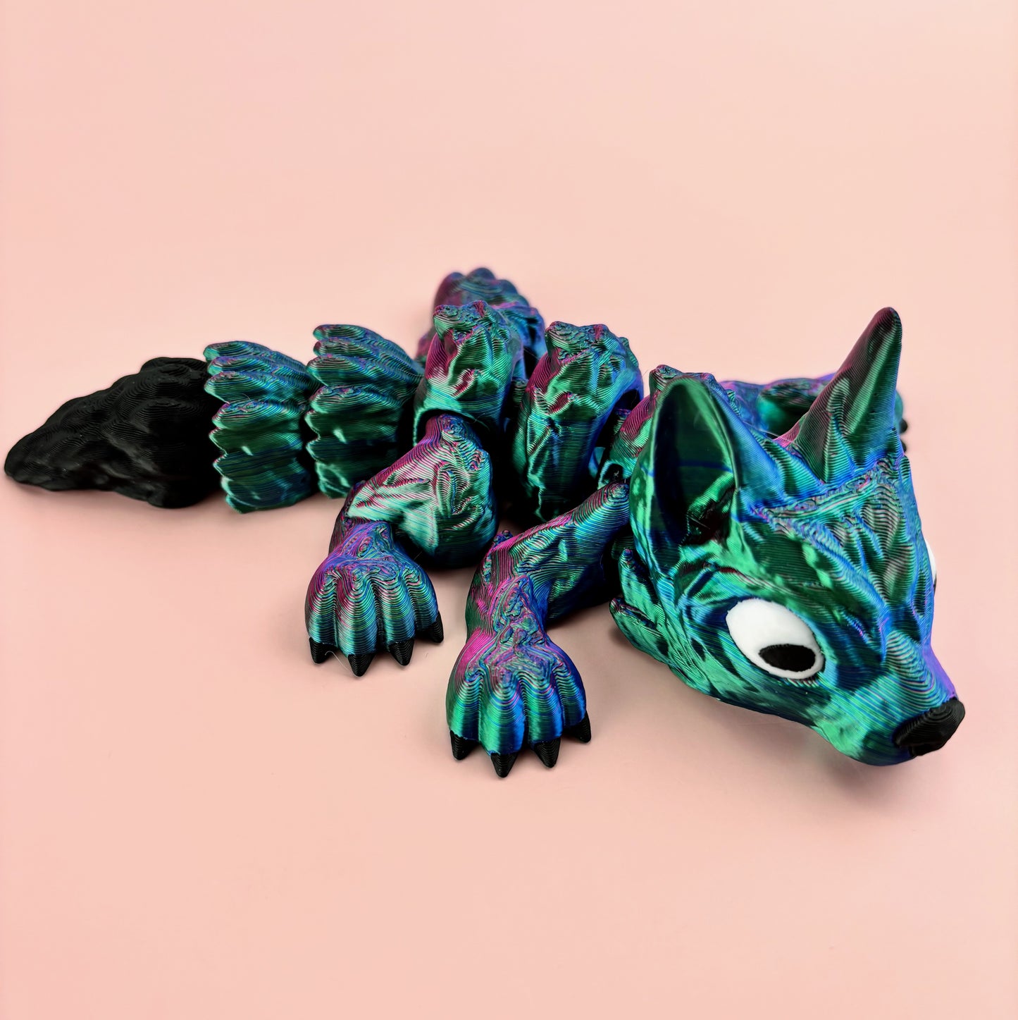 Tiny Wolf Pup 3D Printed in Vibrant Blues, Purples, and Greens.