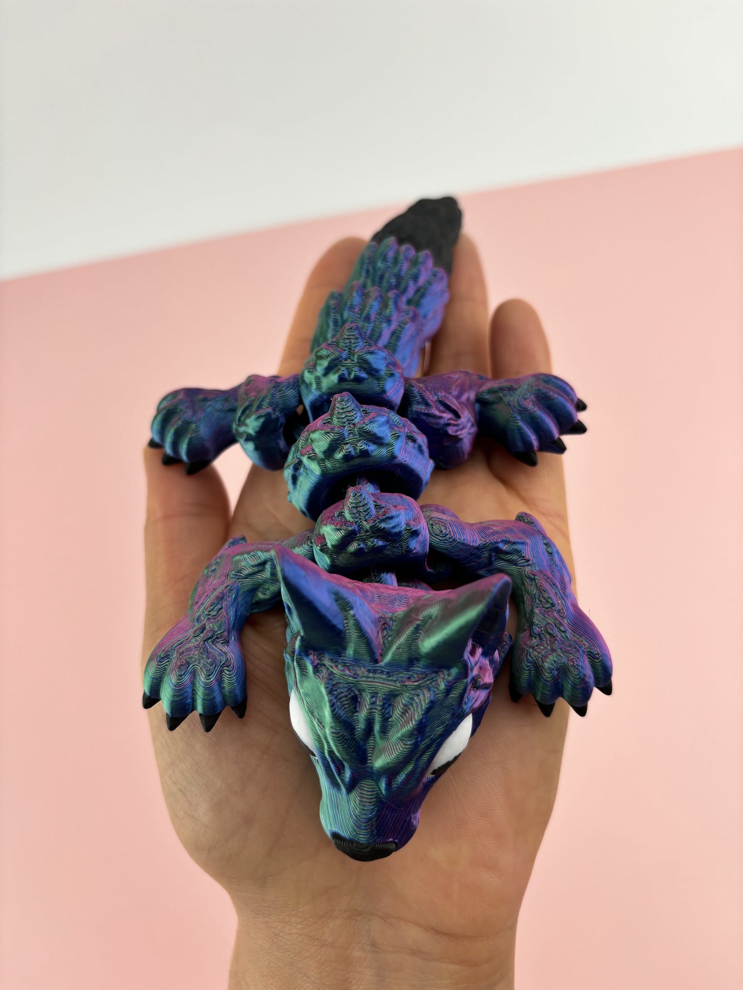 Tiny Wolf Pup 3D Printed in Vibrant Blues, Purples, and Greens.